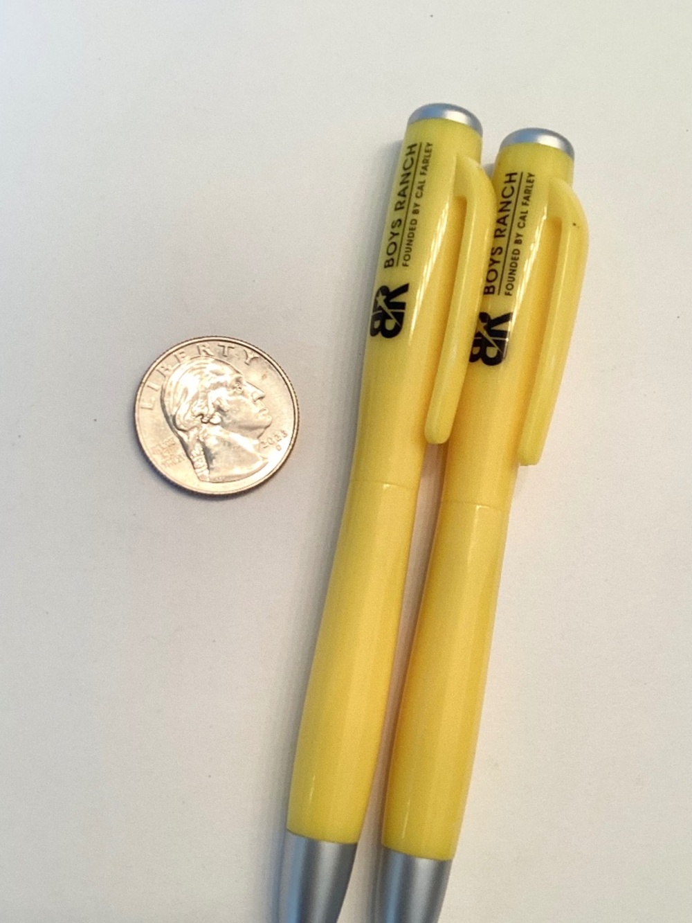 Two BOYS RANCH yellow FLASHLITE PENS… black ink.